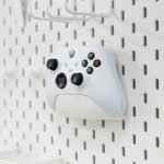 Organize your gaming setup with this pegboard controller holder. Durable, space-saving design perfect for Xbox, PlayStation, and other game controllers