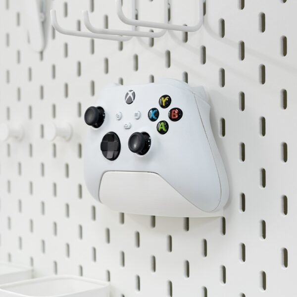 Organize your gaming setup with this pegboard controller holder. Durable, space-saving design perfect for Xbox, PlayStation, and other game controllers