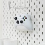 Organize your gaming setup with this pegboard controller holder. Durable, space-saving design perfect for Xbox, PlayStation, and other game controllers - Image 3